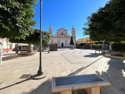 a bench in front of a building with a street light at Apartment Palermo by Interhome in Balestrate