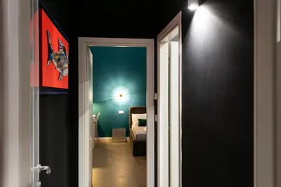 an open door to a room with a bedroom at Carlo Suite Apartments con Vasca Idromassaggio in Palermo