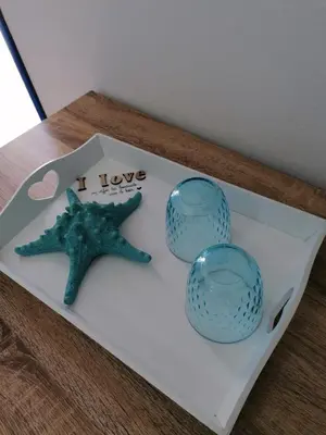 a starfish and two glass vases on a table at B&B Santorini in Cinisi
