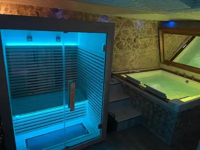 a large bathroom with a tub and a swimming pool at Caveau in Palermo