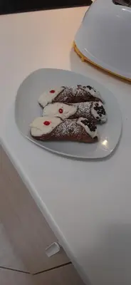 a chocolate dessert on a plate on a counter at La terra del sole in Cinisi