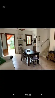 a living room with a table and a couch at Màkari in Macari