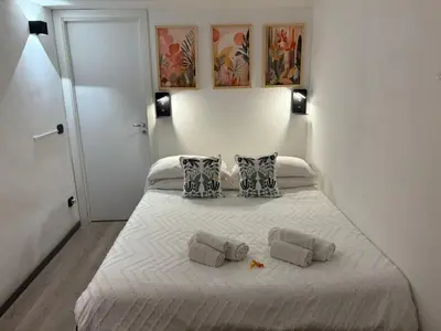 a bedroom with a bed with two pillows on it at Palermo alla Gancia Room in Palermo