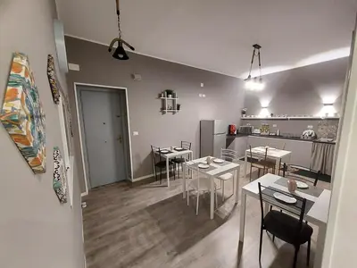 a living room with a tv and a table at La Casa del Moro - Al Politeama in Palermo