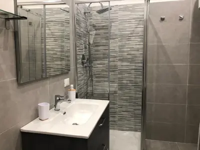 a bathroom with a sink and a shower at Dal Porto al Politeama in Palermo