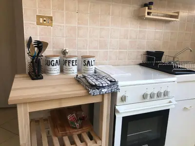 a kitchen with a counter with mugs on it at Dal Porto al Politeama in Palermo