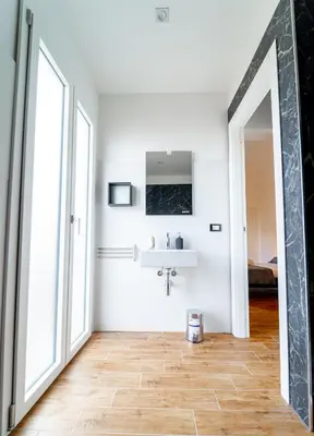 a bathroom with a sink and a mirror at Civico64 apartments in Castellammare del Golfo