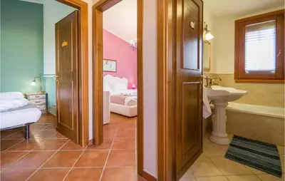 a bathroom with a sink and a toilet and a tub at Beautiful Home In Torre Colonna-Sperone in Mandra Capreria