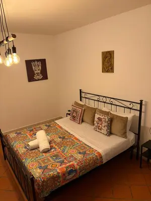 a bedroom with a bed in a room at A casa di Francy in Palermo