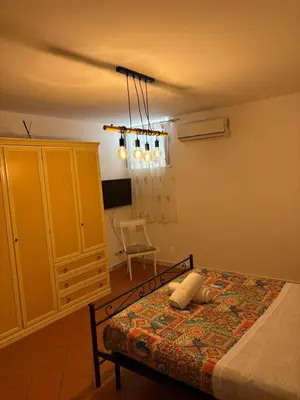 a kitchen with a table with chairs around it at A casa di Francy in Palermo