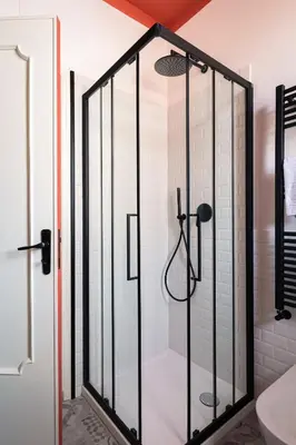 a shower with a glass door in a bathroom at La casetta al Politeama in Palermo