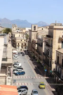 a view of a city street with cars parked at Attico in centro città in Alcamo