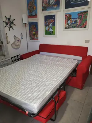 a patio with chairs and tables on a tiled floor at cico appartamento in San Vito lo Capo