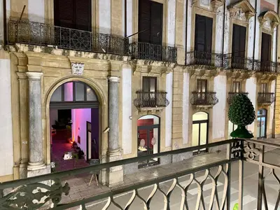 a view of a building with a balcony at Tommy's rooms in Palermo