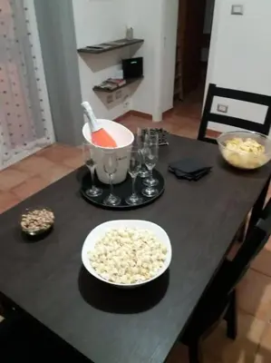 a table with a bowl of food and a bowl of popcorn at Casa vacanza Sole di Sicilia in Palermo