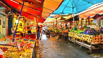 a market with a bunch of fruits and vegetables at IGIEA ROOMS in Palermo