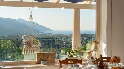 a dining room with a large window with a view at VILLA OLIMPIA 6&2, Emma Villas in Castellammare del Golfo