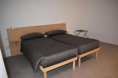 a bed with two pillows on it in a room at GiaChi friendly studios a Ballarò in Palermo