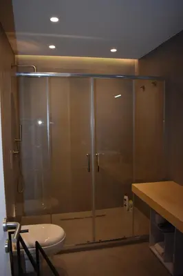 a bathroom with a glass shower with a toilet at GiaChi friendly studios a Ballarò in Palermo