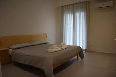 a bedroom with a bed with towels on it at GiaChi friendly studios a Ballarò in Palermo