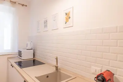 a bathroom with a toilet and a glass shower at NicolHouse - Appartamento nel centro storico di Palermo in Palermo