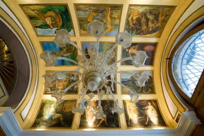 a chandelier hanging from the ceiling in a building at Hotel Joli in Palermo