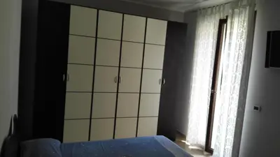 a bedroom with a bed and a window at Villetta Isola in Isola delle Femmine