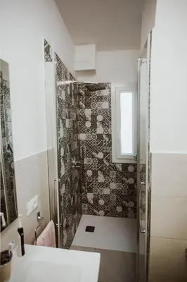a bathroom with a shower and a sink at Casa Vacanze Galati in Palermo