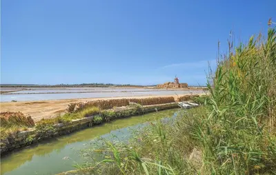 a river next to a body of water at Pietro 4 in San Vito lo Capo