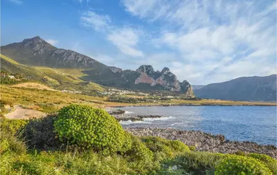 a view of a body of water with mountains in the background at Pietro 4 in San Vito lo Capo