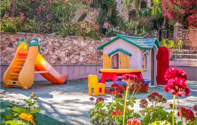 a group of childrens play equipment in a garden at Pietro 4 in San Vito lo Capo