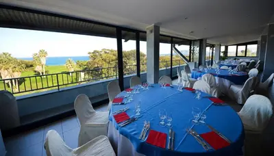 a dining room with blue tables and white chairs at Hotel Villa d'Amato in Palermo