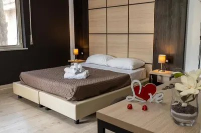 a bedroom with a bed and a table at Exclusive in Palermo