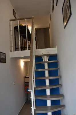 a staircase leading up to a bunk bed in a room at atocà1 casa vacanze - vedi anche atocà2 in Palermo