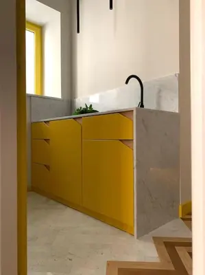 a kitchen with a yellow and gray counter top at The347, Diletta in Palermo