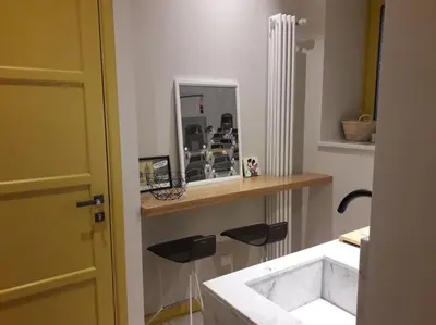 a bathroom with a white sink and a mirror at The347, Diletta in Palermo