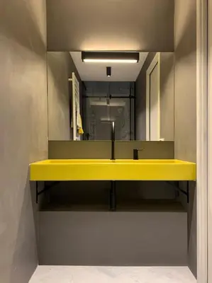 a bathroom with a yellow sink and a mirror at The347, Diletta in Palermo