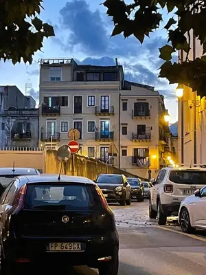 a bunch of cars parked on a city street at Loft Aragonese in Palermo