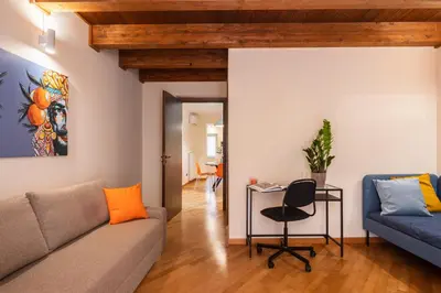 a living room with a couch and a table at Open Sicily Residence - Central Apartments Near Quattro Canti in Palermo