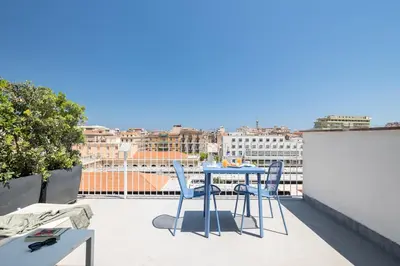 a table and chairs on a balcony with a view at Suite al centro di Palermo con terrazza privata in Palermo