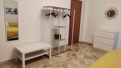 a room with a white table and a mirror at Amunì rooms and suite LT in Palermo