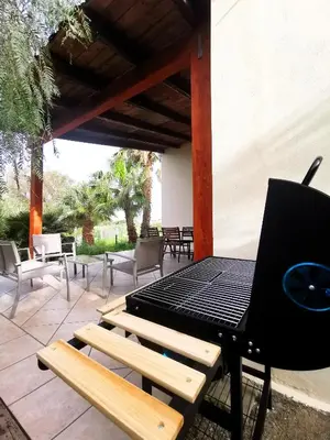 a grill sitting on a picnic table on a patio at L'oasi nello Zingaro in Scopello