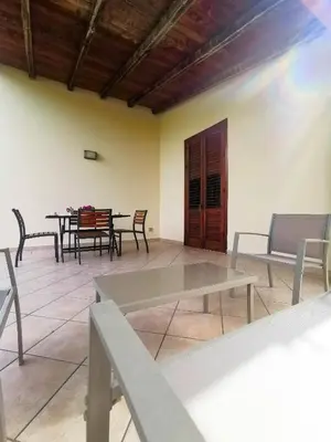 a dining room with a table and chairs at L'oasi nello Zingaro in Scopello