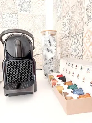 a kitchen with a toaster and a box of cookies at Guest House Palermo Massimo 23 in Palermo