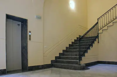 a hallway with a staircase in a building at Antica Palermo in Palermo
