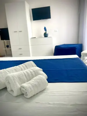 a room with a bed with towels on it at B&B La CYCAS in San Vito lo Capo