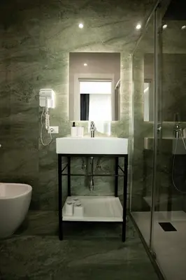 a bathroom with a sink and a shower at Borghi di Belmonte in Palermo