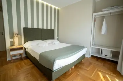 a bedroom with a bed with two towels on it at Borghi di Belmonte in Palermo