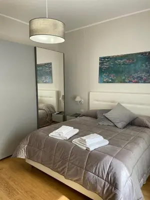 a bedroom with a bed with two towels on it at Luxury Apartament's Celso in Palermo