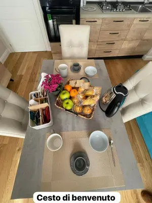 a table with a tray of food on it in a kitchen at Luxury Apartament's Celso in Palermo